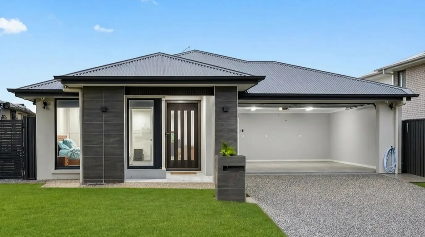 Greenbank Oasis front exterior with double garage open, showing secure off-street parking for two vehicles in Brisbane southside