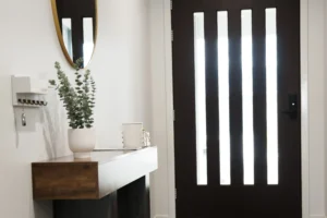 Front entry at Greenbank Oasis SafeStayz accommodation in Brisbane southside, with secure keyless entry door, key hooks, console table and styled welcome details